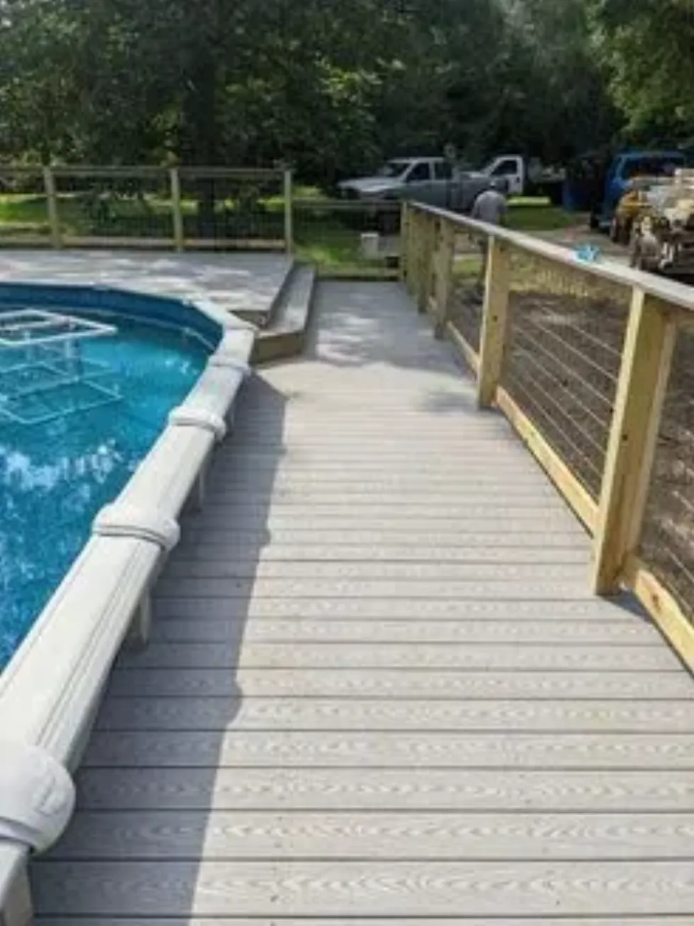 Composite deck built around a backyard pool on the Northshore, LA